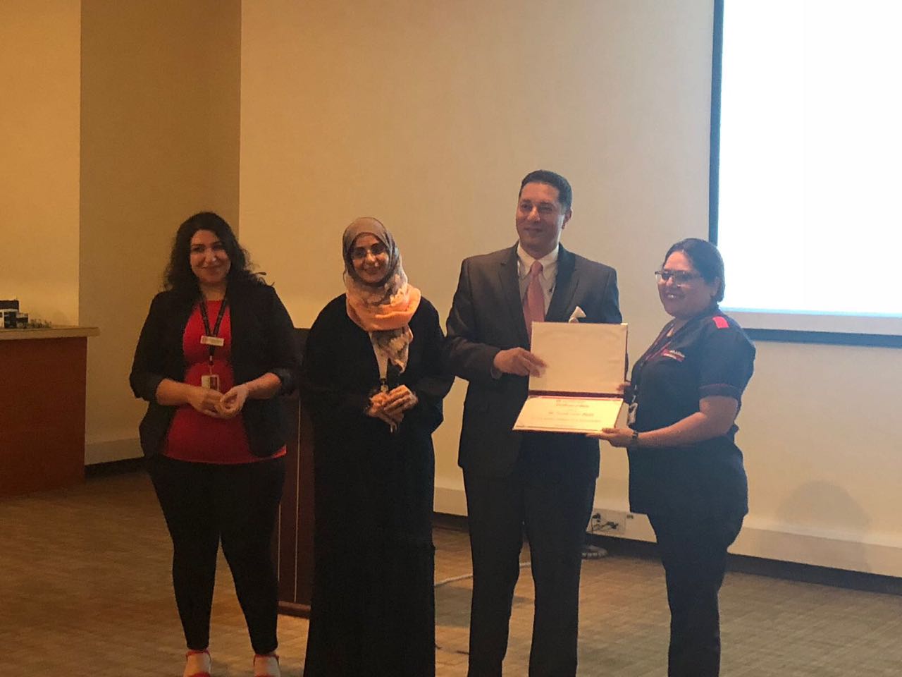 Fouzia Lucas manager of the oncology unit receiving recognition award 🥇 from alzahra hospital Adminstrative August 2018 Dubai UAE